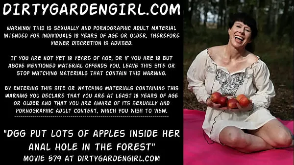 XXX DGG insert apples in her large prolapse in public woods megafilms