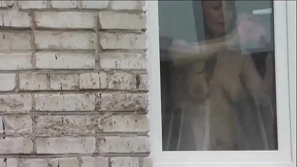 XXX Naked in public. Nude. Outdoor. Outside. Husband Sexy Frina is spying on her from car window when she washes apartment window no panties and bra mega Movies